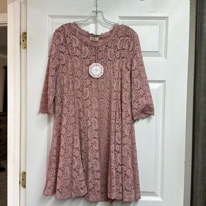 Very pretty pink lacy top. Never been worn!